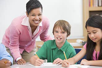 Teacher and pupil in elementary school classroom