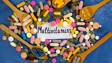 Various tablets and capsules, supplements and vitamins. Selective focus.