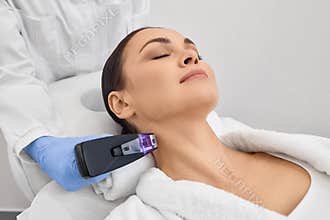 RF microneedling is cosmetic procedure for tighten and rejuvenate skin on woman patient neck.
