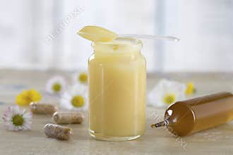 Raw organic royal jelly in a small bottle