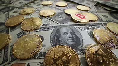 Gold Bit Coin BTC coins and dollar bills