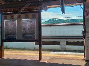 A station platform in Japan with promotional posters