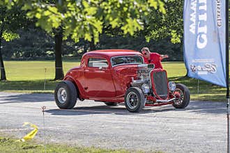 Ford three window hot rod arriving at car show
