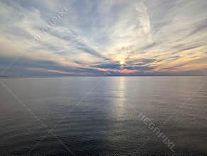 Peaceful Ocean sunset with reflections