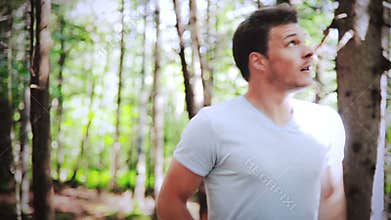 Handsome Man running Alone in the forest