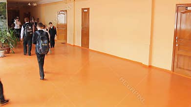 Pupil at the school go along the corridor