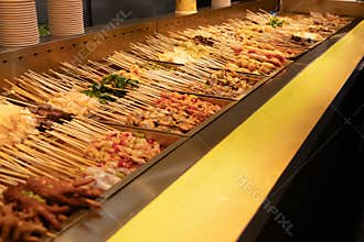 Grilled skewer buffet with assorted meat and vegetable in warm restaurant display