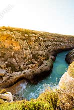 The narrow inlet and beach at Wied il-Ghasri, Gozo. Malta