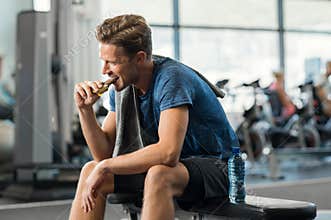 Man eating energy bar
