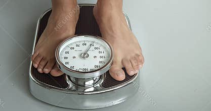 Checking the weight on a scale