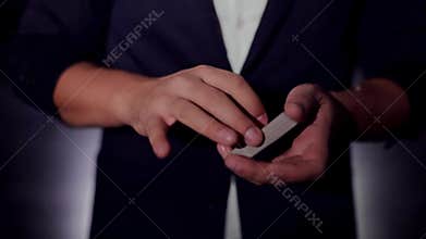 Card trick. The magician`s hands.