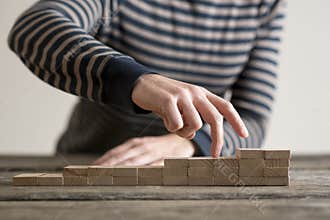 Fingers of a hand tracing out the ascent