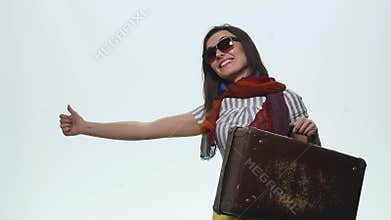 Smiling casual woman pointing finger away isolated on a white background