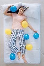 Joyful nice woman being surrounded by balloons