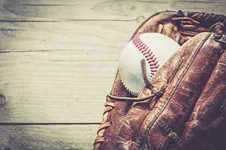 Old and worn used leather baseball sport glove over aged