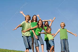 Group of kids arms raised or outstretched