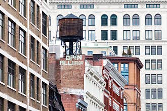 New York City historic Manhattan buildings with `open all borders` message