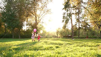Two sisters with balloons