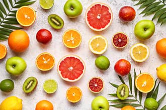 Citrus fruits background mix flat lay, summer healthy vegetarian food, antioxidant detox nutrition diet