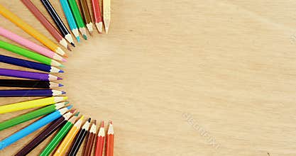 Colored pencils arranged in semi circle