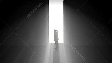 Lonely businessman standing in front of the huge gate