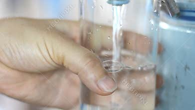 Woman holding water bottle and serving water