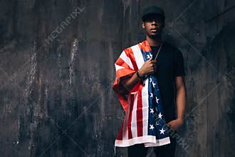 Black man with american flag on shoulder