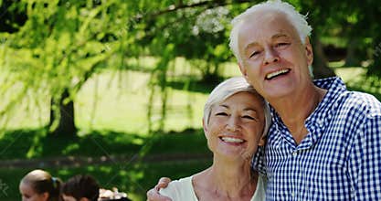 Senior couple embracing each other in the park