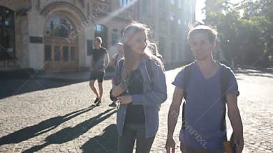Attractive couple of students walking on campus
