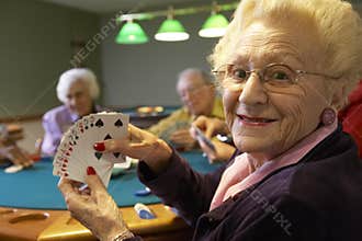 Senior adults playing bridge