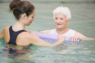 Therapist And Senior Patient In Hydro Pool