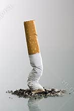 Cigarett end crushed into ashtray