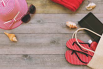 Summer holiday background with beach items and digital tablet. View from above