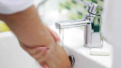 Close up of man hand turning off dripping ,Silver faucet toilet