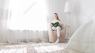 Woman going to read in her bedroom