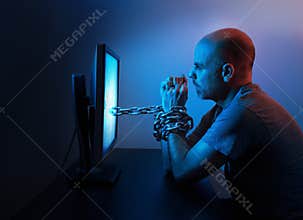 Man chained to computer