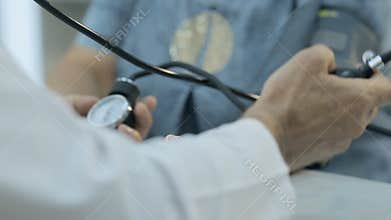 Close-up of doctor who measures the pressure of