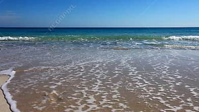 Beach with fresh footprints washed away