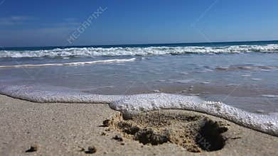Beach with fresh footprints washed away
