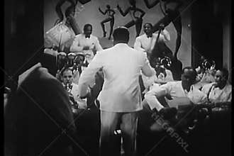 Band leader conducting musicians in1930s nightclub