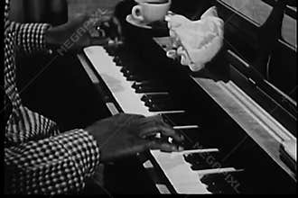 Medium shot of man playing piano