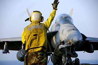 F-18 Hornet and Sailors