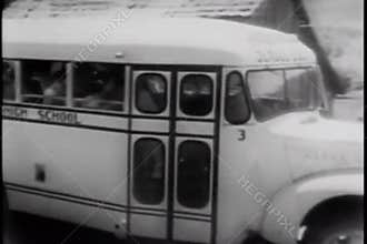 High school students in school bus leaving school in the country