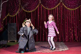Children Dressed as Clowns Performing on Stage