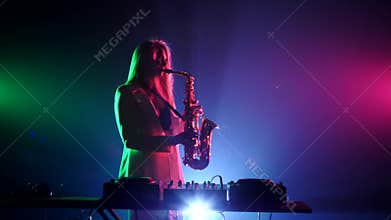 Young sexy, blonde woman dj in white jacket and