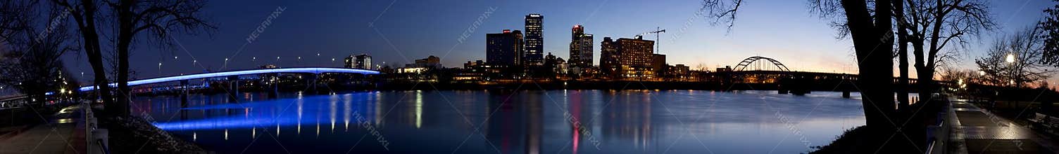 Panoramic evening cityscape of Little Rock, Arkansas, from across the Arkansas River.