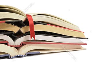 Pile of open books isolated on white background.