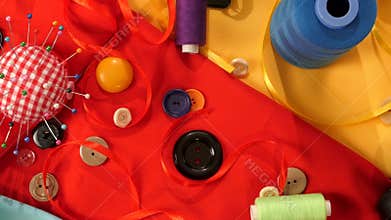 Colorful thread, buttons, pincushion, measuring