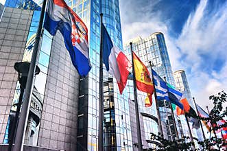 Flags in front of European Parliament building. Brussels, Belgium