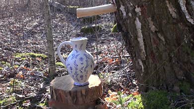 Spring birch sap drops in decorative ceramic pitcher jar